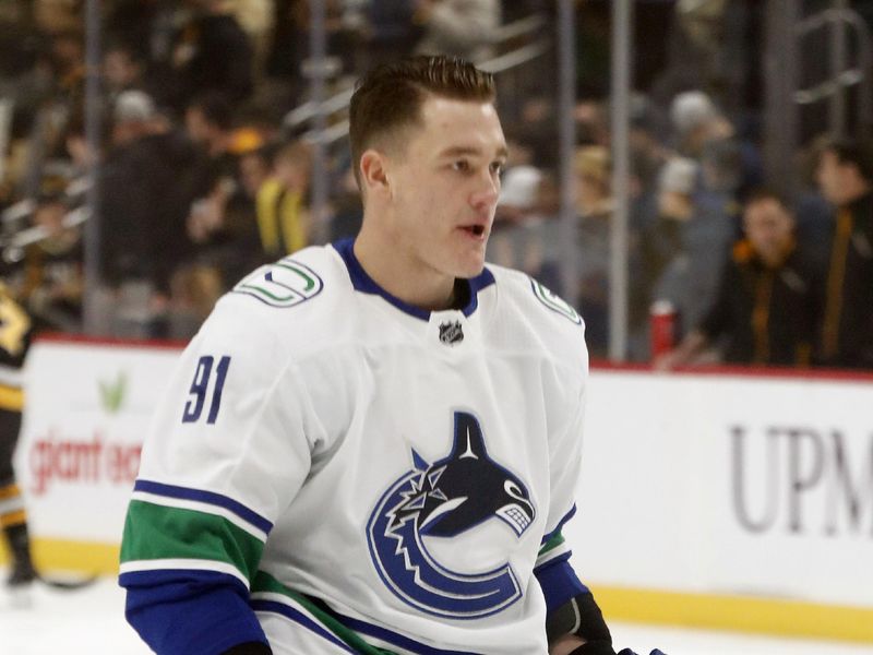 Jan 11, 2024; Pittsburgh, Pennsylvania, USA; Vancouver Canucks defenseman Nikita Zadorov (91) warms up before the game against the Pittsburgh Penguins at PPG Paints Arena. Mandatory Credit: Charles LeClaire-USA TODAY Sports