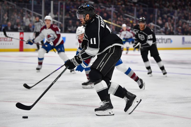 Dec 3, 2023; Los Angeles, California, USA; Los Angeles Kings center Anze Kopitar (11) moves in for a shot against the Colorado Avalanche during the first period at Crypto.com Arena. Mandatory Credit: Gary A. Vasquez-USA TODAY Sports