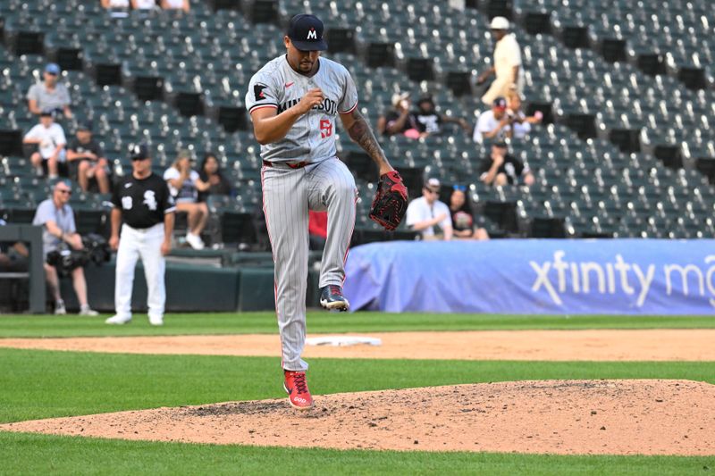 Jul 10, 2024; Chicago, Illinois, USA;  Minnesota Twins pitcher Jhoan Duran (59) reacts after a game against the Chicago White Sox at Guaranteed Rate Field. Mandatory Credit: Matt Marton-USA TODAY Sports