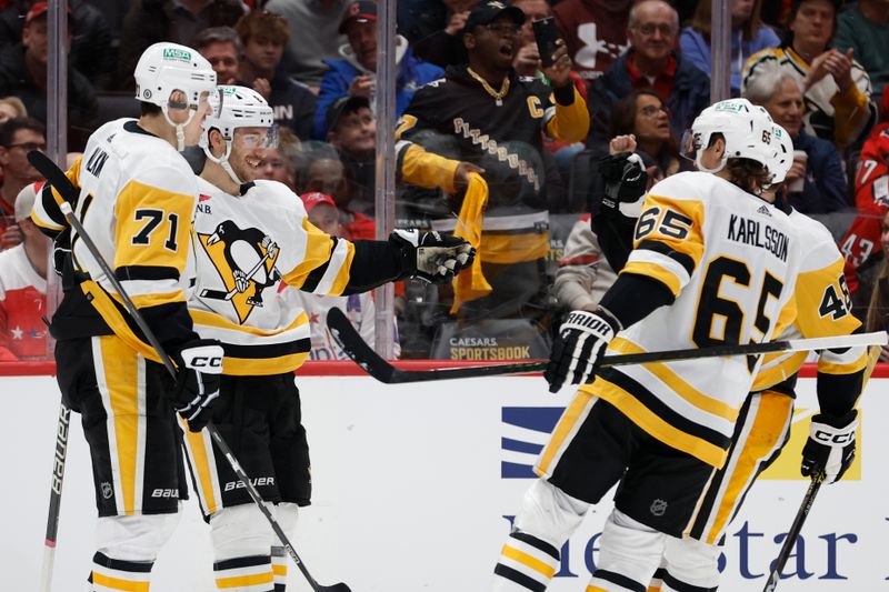 Apr 4, 2024; Washington, District of Columbia, USA; Pittsburgh Penguins left wing Michael Bunting (8) celebrates with teammates after scoring a goal against the Washington Capitals in the second period at Capital One Arena. Mandatory Credit: Geoff Burke-USA TODAY Sports