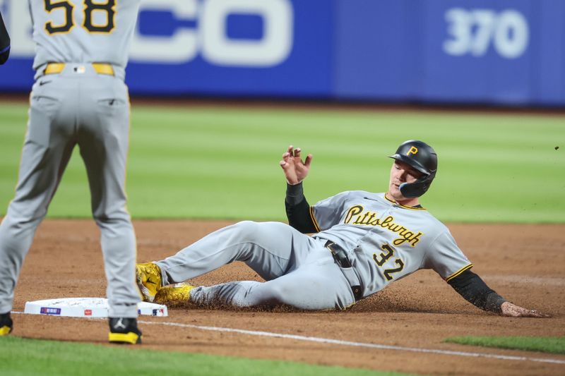 May 13, 2025; New York City, New York, USA; Pittsburgh Pirates catcher Henry Davis (32) slides safely into third base in the third inning against the New York Mets at Citi Field. Mandatory Credit: Wendell Cruz-Imagn Images