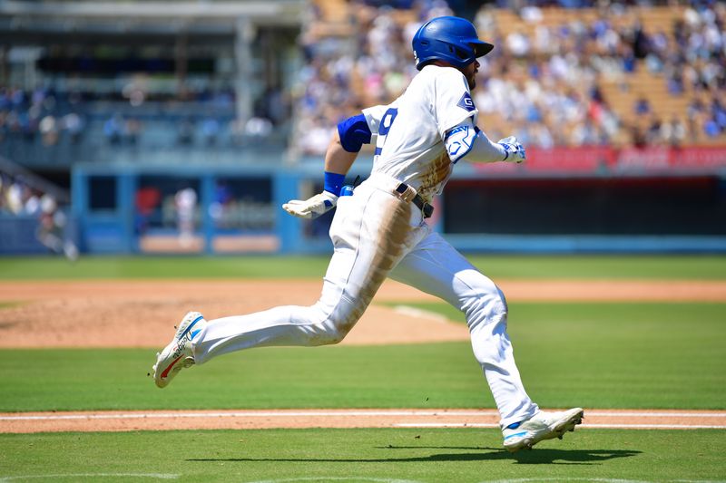 Jul 25, 2024; Los Angeles, California, USA; Los Angeles Dodgers second baseman Gavin Lux (9) runs after hitting a double against the San Francisco Giants during the fourth inning at Dodger Stadium. Mandatory Credit: Gary A. Vasquez-USA TODAY Sports