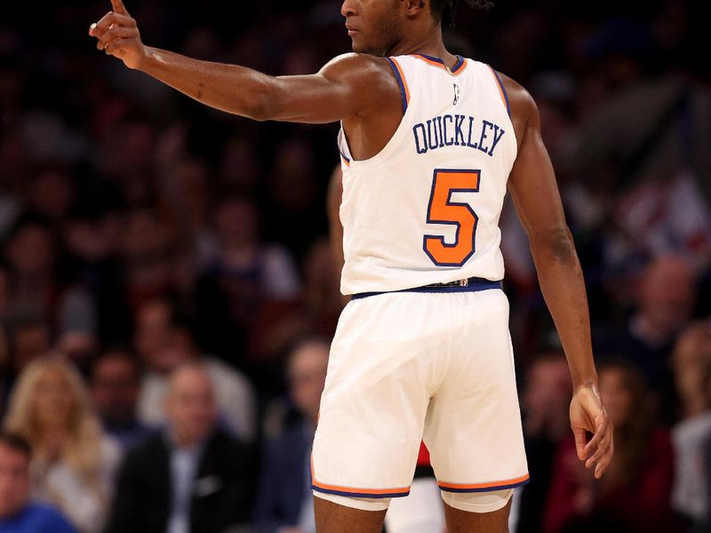 NEW YORK, NEW YORK - MARCH 27: Immanuel Quickley #5 of the New York Knicks celebrates his three point shot during the first half against the Houston Rockets at Madison Square Garden on March 27, 2023 in New York City. NOTE TO USER: User expressly acknowledges and agrees that, by downloading and or using this photograph, User is consenting to the terms and conditions of the Getty Images License Agreement. (Photo by Elsa/Getty Images)