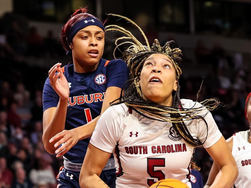 Jan 5, 2023; Columbia, South Carolina, USA; South Carolina Gamecocks forward Victaria Saxton (5) looks to shoot over Auburn Tigers forward Mya Pratcher (1) in the first half at Colonial Life Arena. Mandatory Credit: Jeff Blake-USA TODAY Sports