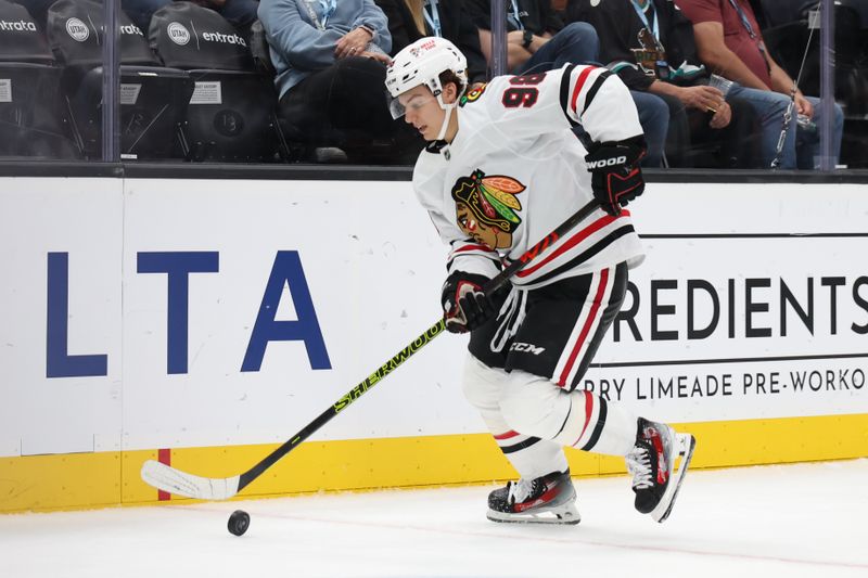 Oct 8, 2024; Salt Lake City, Utah, USA; Chicago Blackhawks center Connor Bedard (98) advances the puck against the Utah Hockey Club during the third period at Delta Center. Mandatory Credit: Rob Gray-Imagn Images