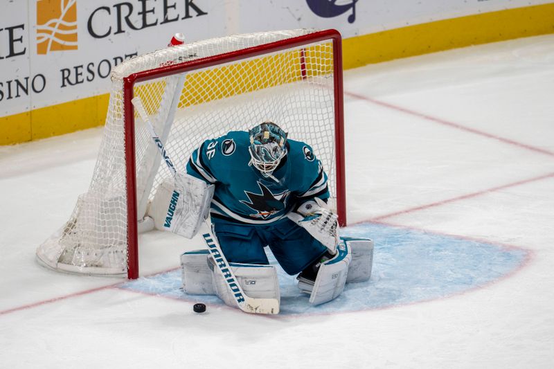 Dec 19, 2023; San Jose, California, USA; San Jose Sharks goaltender Kaapo Kahkonen (36) makes a save against the Los Angeles Kings during the third period at SAP Center at San Jose. Mandatory Credit: Neville E. Guard-USA TODAY Sports