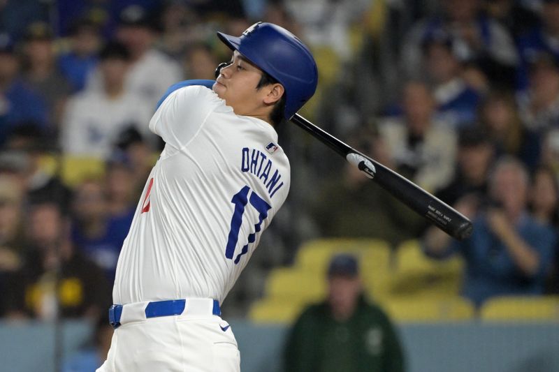 Sep 26, 2024; Los Angeles, California, USA;  Los Angeles Dodgers designated hitter Shohei Ohtani (17) flies out in the first inning against the San Diego Padres at Dodger Stadium. Mandatory Credit: Jayne Kamin-Oncea-Imagn Images