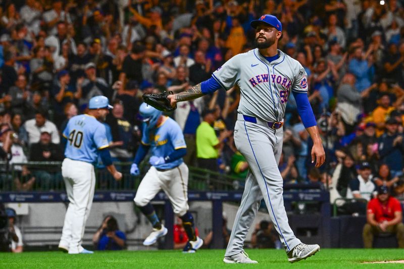 Sep 27, 2024; Milwaukee, Wisconsin, USA; New York Mets pitcher Sean Manaea (59) reacts after giving up a grand slam home run to Milwaukee Brewers first baseman Rhys Hoskins (12) in the first inning at American Family Field. Mandatory Credit: Benny Sieu-Imagn Images