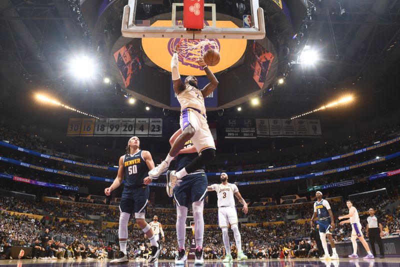 LOS ANGELES, CA - APRIL 27: LeBron James #23 of the Los Angeles Lakers dunks the ball during the game against the Denver Nuggets during Round 1 Game 4 of the 2024 NBA Playoffs on April 27, 2024 at Crypto.Com Arena in Los Angeles, California. NOTE TO USER: User expressly acknowledges and agrees that, by downloading and/or using this Photograph, user is consenting to the terms and conditions of the Getty Images License Agreement. Mandatory Copyright Notice: Copyright 2024 NBAE (Photo by Andrew D. Bernstein/NBAE via Getty Images)