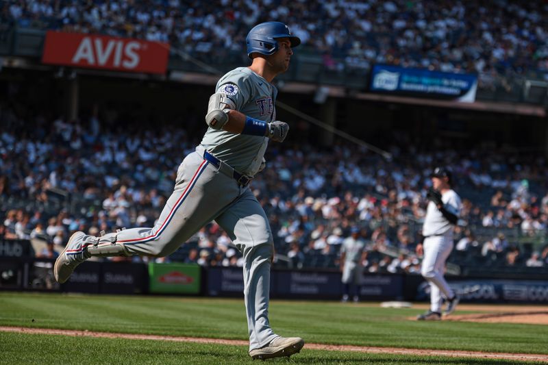 Aug 11, 2024; Bronx, New York, USA; Texas Rangers first baseman Nathaniel Lowe (30) rounds the bases after hitting a solo home run against New York Yankees relief pitcher Mark Leiter Jr. (38) during the eighth inning at Yankee Stadium. Mandatory Credit: Vincent Carchietta-USA TODAY Sports