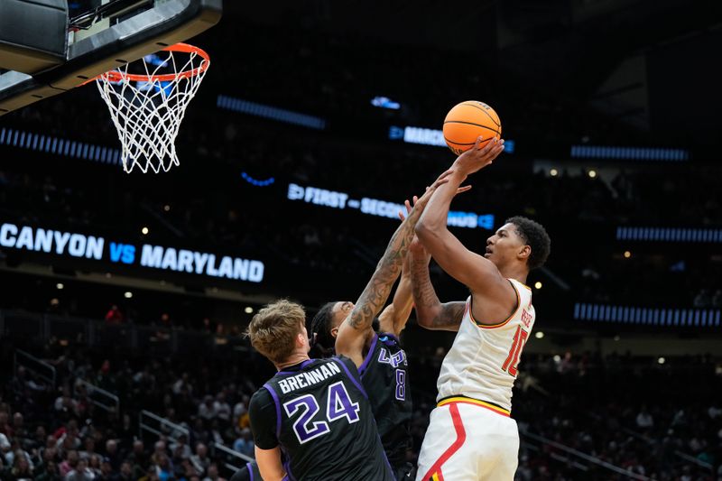 Mar 21, 2025; Seattle, WA, USA; Maryland Terrapins forward Julian Reese (10) attempts a shot while being defended by Grand Canyon Antelopes guard Collin Moore (8) at Climate Pledge Arena. Mandatory Credit: Stephen Brashear-Imagn Images