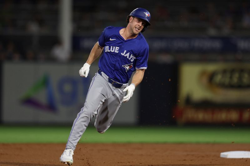 Mar 1, 2024; Tampa, Florida, USA;  Toronto Blue Jays third baseman Ernie Clement (28) runs to third base after hitting a triple against the New York Yankees in the first inning at George M. Steinbrenner Field. Mandatory Credit: Nathan Ray Seebeck-USA TODAY Sports