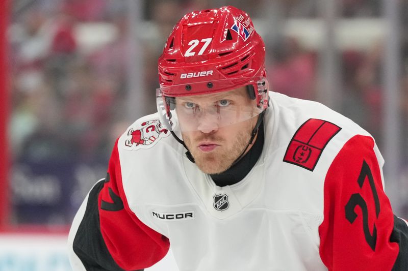 Sep 24, 2025; Raleigh, North Carolina, USA;  Carolina Hurricanes left wing Nikolaj Ehlers (27) looks on against the Florida Panthers during the third period at Lenovo Center. Mandatory Credit: James Guillory-Imagn Images
