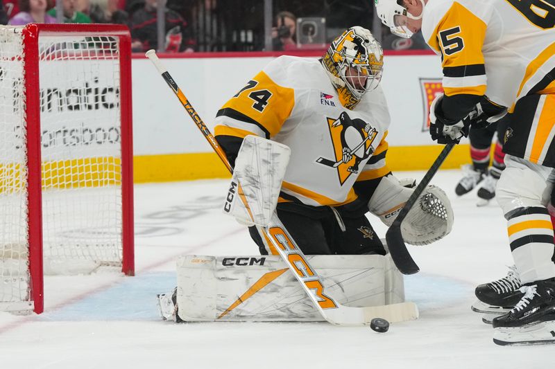 Mar 10, 2026; Raleigh, North Carolina, USA;  Pittsburgh Penguins goaltender Stuart Skinner (74) makes a save against the Pittsburgh Penguins during the first period at Lenovo Center. Mandatory Credit: James Guillory-Imagn Images