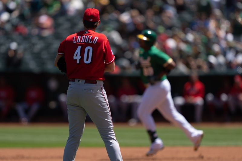 Apr 30, 2023; Oakland, California, USA;  Cincinnati Reds starting pitcher Nick Lodolo (40) watches Oakland Athletics first baseman Jesus Aguilar (99) run the bases after hitting a two run home run at RingCentral Coliseum. Mandatory Credit: Stan Szeto-USA TODAY Sports