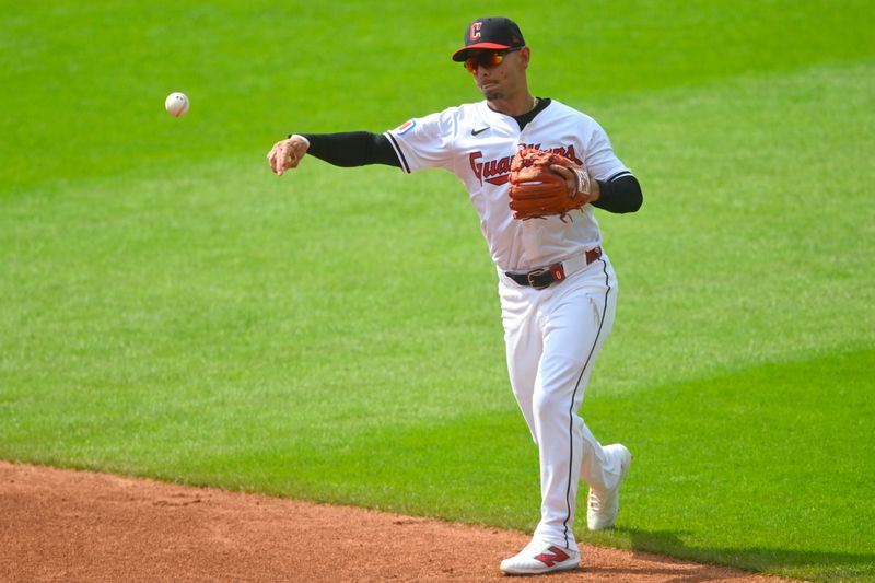 Jun 22, 2024; Cleveland, Ohio, USA; Cleveland Guardians second baseman Andres Gimenez (0) throws to first base in the second inning against the Toronto Blue Jays at Progressive Field. Mandatory Credit: David Richard-USA TODAY Sports