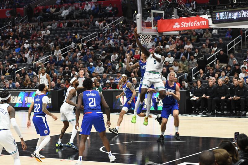 LOS ANGELES, CA - MARCH 12:  Anthony Edwards #5 of the Minnesota Timberwolves drives to the basket during the game against the LA Clippers on March 12, 2024 at Crypto.Com Arena in Los Angeles, California. NOTE TO USER: User expressly acknowledges and agrees that, by downloading and/or using this Photograph, user is consenting to the terms and conditions of the Getty Images License Agreement. Mandatory Copyright Notice: Copyright 2024 NBAE (Photo by Tyler Ross/NBAE via Getty Images)