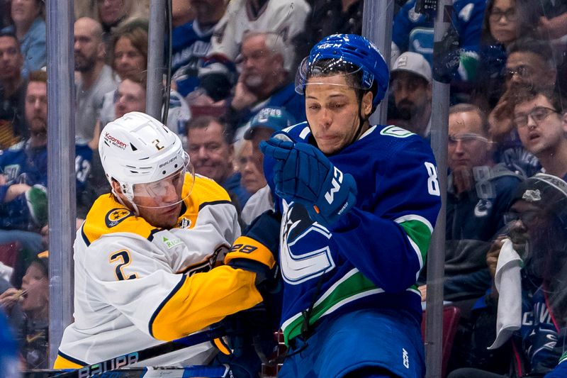 Apr 23, 2024; Vancouver, British Columbia, CAN; Nashville Predators defenseman Luke Schenn (2) checks Vancouver Canucks forward Dakota Joshua (81) during the third period in game two of the first round of the 2024 Stanley Cup Playoffs at Rogers Arena. Mandatory Credit: Bob Frid-USA TODAY Sports