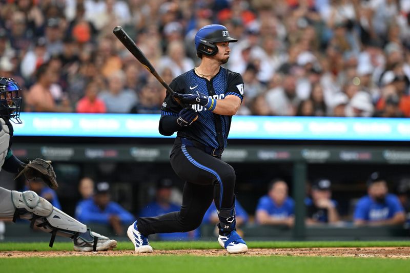 Jul 11, 2025; Detroit, Michigan, USA; Detroit Tigers third baseman Zach McKinstry (39) hits an RBI single against the Seattle Mariners in the fourth inning at Comerica Park. Mandatory Credit: Lon Horwedel-Imagn Images
