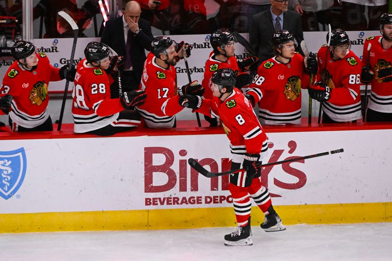 Jan 20, 2025; Chicago, Illinois, USA;  Chicago Blackhawks center Ryan Donato (8) celebrates his goal against the Carolina Hurricanes with teammates during the second period at the United Center. Mandatory Credit: Matt Marton-Imagn Images


