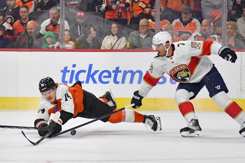 Mar 24, 2024; Philadelphia, Pennsylvania, USA; Philadelphia Flyers right wing Tyson Foerster (71) dives for the puck against Florida Panthers defenseman Dmitry Kulikov (7) during the first period at Wells Fargo Center. Mandatory Credit: Eric Hartline-USA TODAY Sports