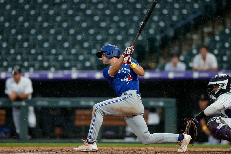 Sep 3, 2023; Denver, Colorado, USA; Toronto Blue Jays shortstop Ernie Clement (28) this an RBI single in the ninth inning against the Colorado Rockies at Coors Field. Mandatory Credit: Isaiah J. Downing-USA TODAY Sports