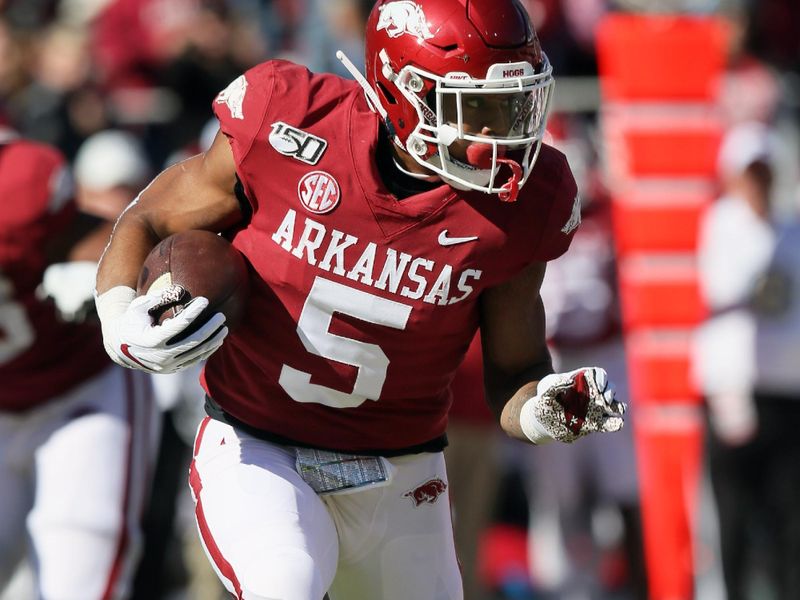 Nov 9, 2019; Fayetteville, AR, USA; Arkansas Razorbacks running back Rakeem Boyd (5) rushes in the first quarter against the Western Kentucky Hilltoppers at Donald W. Reynolds Razorback Stadium. Mandatory Credit: Nelson Chenault-USA TODAY Sports