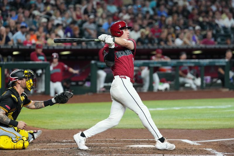 Jul 28, 2024; Phoenix, Arizona, USA; Arizona Diamondbacks outfielder Jake McCarthy (31) hits an RBI triple against the Pittsburgh Pirates during the fourth inning at Chase Field. Mandatory Credit: Joe Camporeale-USA TODAY Sports