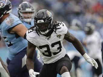 Jacksonville Jaguars linebacker Devin Lloyd (33) defends during the second half of an NFL football game against the Tennessee Titans, Sunday, Dec. 8, 2024, in Nashville, Tenn. (AP Photo/Stew Milne)