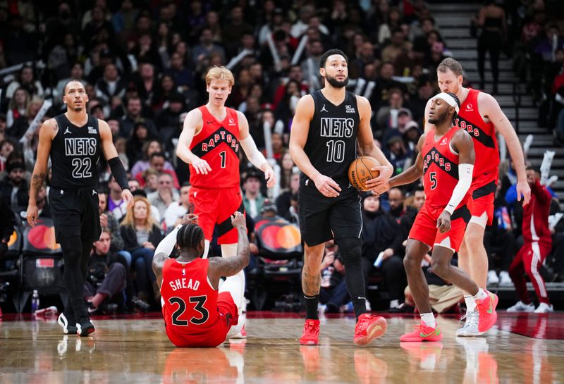 TORONTO, ON - JANUARY 1: Ben Simmons #10 of the Brooklyn Nets reacts during a pause in play against Jamal Shead #23, Gradey Dick #1, Immanuel Quickley #5 and Jakob Poeltl #19 of the Toronto Raptors during the second half at the Scotiabank Arena on January 1, 2025 in Toronto, Ontario, Canada. NOTE TO USER: User expressly acknowledges and agrees that, by downloading and/or using this Photograph, user is consenting to the terms and conditions of the Getty Images License Agreement. (Photo by Mark Blinch/Getty Images)
