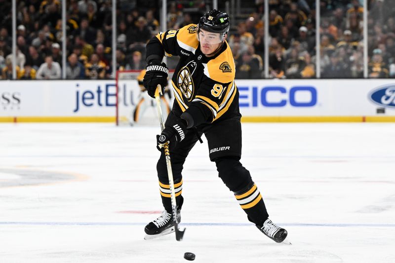 Nov 3, 2024; Boston, Massachusetts, USA; Boston Bruins defenseman Nikita Zadorov (91) takes a shot against the Seattle Kraken during the first period at the TD Garden. Mandatory Credit: Brian Fluharty-Imagn Images