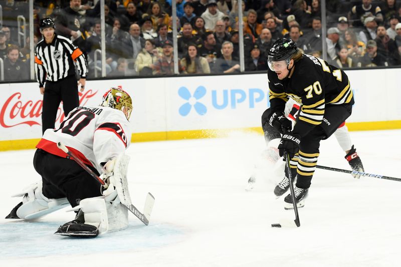 Mar 19, 2024; Boston, Massachusetts, USA;  Boston Bruins center Jesper Boqvist (70) handles the puck in front of Ottawa Senators goaltender Joonas Korpisalo (70) during the third period at TD Garden. Mandatory Credit: Bob DeChiara-USA TODAY Sports