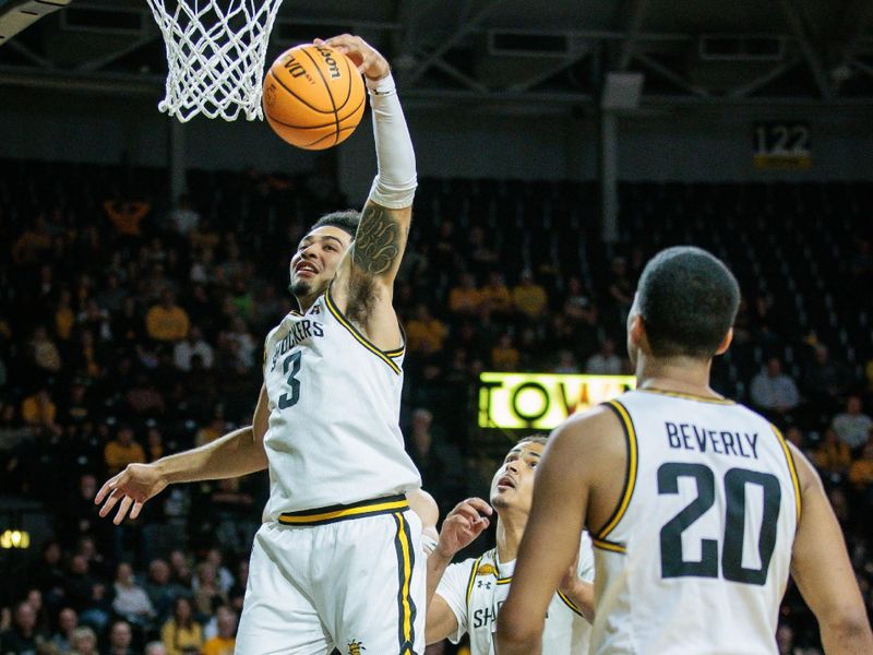 Mar 2, 2024; Wichita, Kansas, USA; Wichita State Shockers forward Ronnie DeGray III (3) rebounds during the second half against the Rice Owls at Charles Koch Arena. Mandatory Credit: William Purnell-USA TODAY Sports