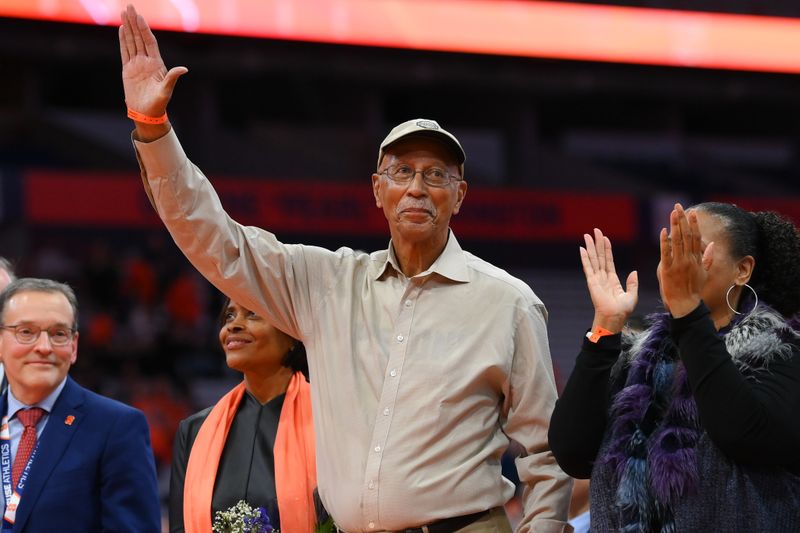 Jan 27, 2024; Syracuse, New York, USA; Former Syracuse Orange great Dave Bing waves to the fans during his Ring of Honor induction ceremony at half time of the game against the North Carolina State Wolfpack at the JMA Wireless Dome. Mandatory Credit: Rich Barnes-USA TODAY Sports