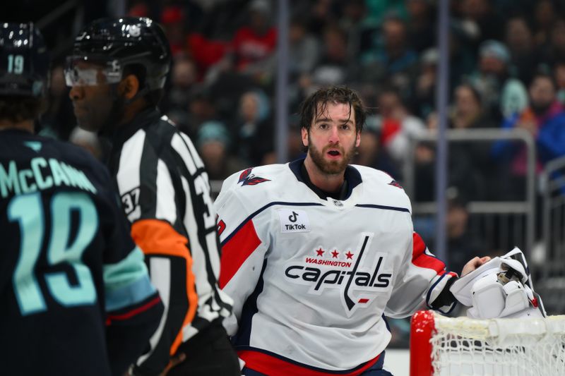 Jan 27, 2026; Seattle, Washington, USA; Washington Capitals goaltender Logan Thompson (48) after getting hit in the mask with the puck during the second period against the Seattle Kraken at Climate Pledge Arena. Mandatory Credit: Steven Bisig-Imagn Images