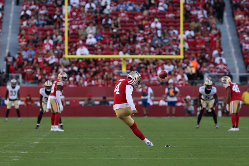 San Francisco 49ers kicker Jake Moody (4) kicks off against the New Orleans Saints during the first half of a preseason NFL football game in Santa Clara, Calif., Sunday, Aug. 18, 2024. (AP Photo/Jed Jacobsohn)