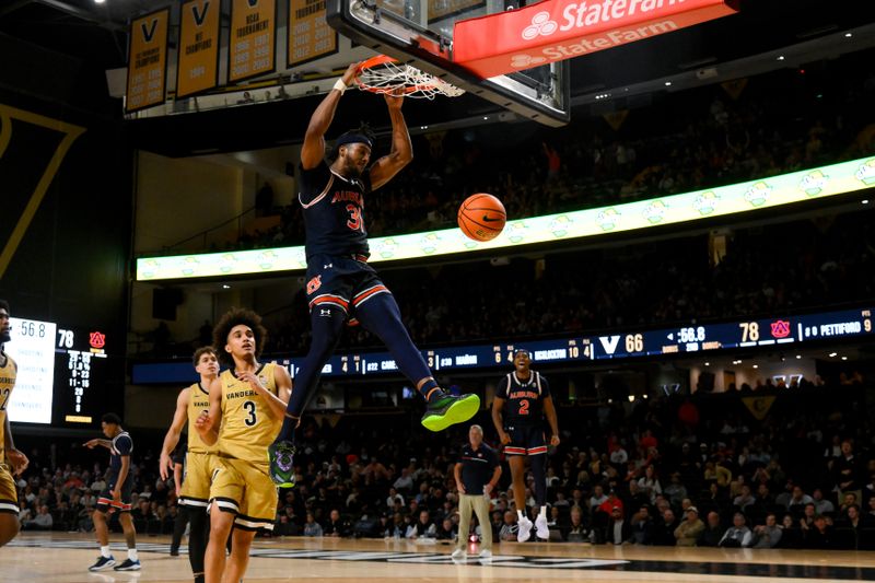 Feb 11, 2025; Nashville, Tennessee, USA; Auburn Tigers forward Jahki Howard (3) dunks the ball against the Auburn Tigers during the second half at Memorial Gymnasium. Mandatory Credit: Steve Roberts-Imagn Images