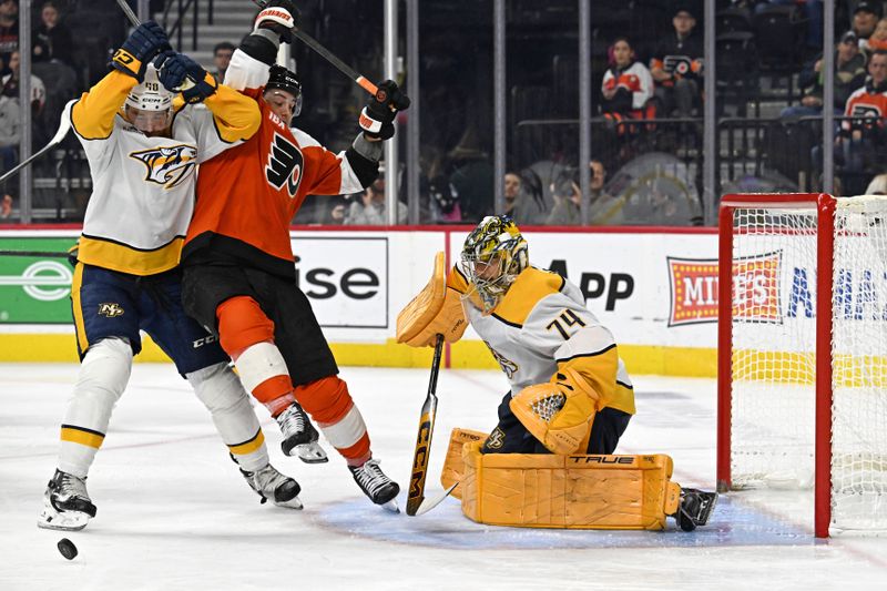 Oct 30, 2025; Philadelphia, Pennsylvania, USA; Nashville Predators defenseman Nick Perbix (48) battles with Philadelphia Flyers right wing Tyson Foerster (71) in front of  goaltender Juuse Saros (74) during the third period at Xfinity Mobile Arena. Mandatory Credit: Eric Hartline-Imagn Images