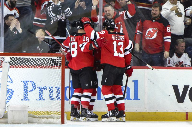 Feb 8, 2024; Newark, New Jersey, USA; New Jersey Devils left wing Ondrej Palat (18) celebrates with teammates after scoring a goal against the Calgary Flames during the first period at Prudential Center. Mandatory Credit: John Jones-USA TODAY Sports