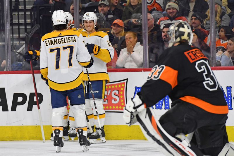 Dec 21, 2023; Philadelphia, Pennsylvania, USA; Nashville Predators center Philip Tomasino (26) celebrates his goal with right wing Luke Evangelista (77) against the Philadelphia Flyers during the third period at Wells Fargo Center. Mandatory Credit: Eric Hartline-USA TODAY Sports