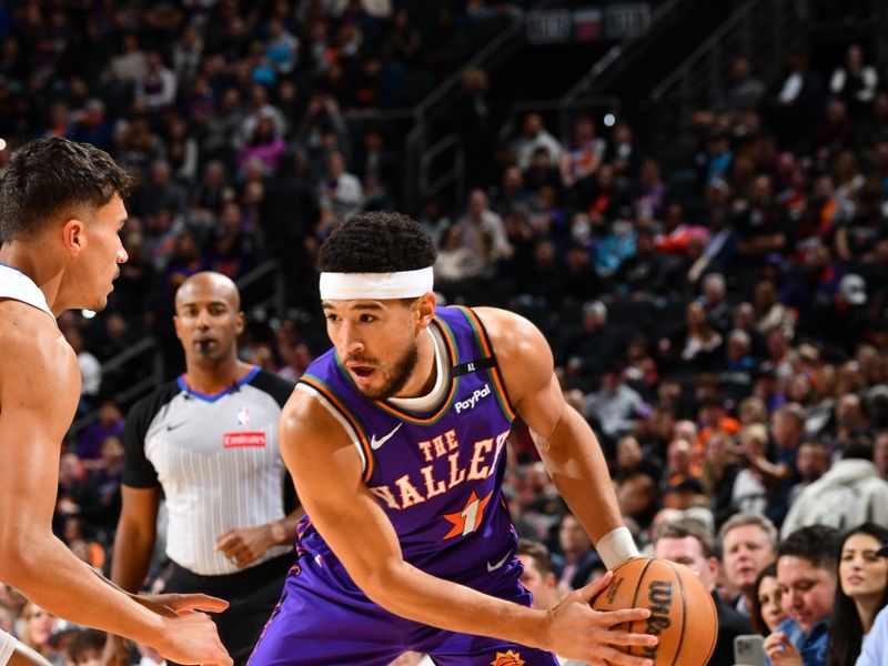 PHOENIX, AZ - NOVEMBER 18: Devin Booker #1 of the Phoenix Suns handles the ball during the game against the Orlando Magic on November 18, 2024 at Footprint Center in Phoenix, Arizona. NOTE TO USER: User expressly acknowledges and agrees that, by downloading and or using this photograph, user is consenting to the terms and conditions of the Getty Images License Agreement. Mandatory Copyright Notice: Copyright 2024 NBAE (Photo by Barry Gossage/NBAE via Getty Images)