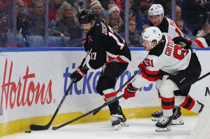 Nov 28, 2025; Buffalo, New York, USA;  Buffalo Sabres left wing Jason Zucker (17) and New Jersey Devils center Dawson Mercer (91) go after a loose puck during the first period at KeyBank Center. Mandatory Credit: Timothy T. Ludwig-Imagn Images