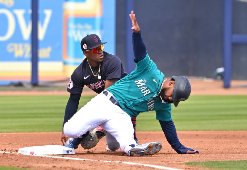 Feb 28, 2023; Peoria, Arizona, USA; Seattle Mariners right fielder Teoscar Hernandez (35) beats the tag by Cleveland Guardians second baseman Angel Martinez (79) in the first inning of a spring training game at the Peoria Sports Complex. Mandatory Credit: Jayne Kamin-Oncea-USA TODAY Sports