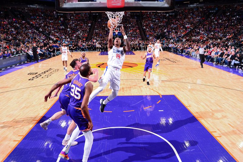 PHOENIX, AZ - APRIL  9: Terance Mann #14 of the LA Clippers shoots the ball during the game against the Phoenix Suns on April 9, 2024 at Footprint Center in Phoenix, Arizona. NOTE TO USER: User expressly acknowledges and agrees that, by downloading and or using this photograph, user is consenting to the terms and conditions of the Getty Images License Agreement. Mandatory Copyright Notice: Copyright 2024 NBAE (Photo by Kate Frese/NBAE via Getty Images)