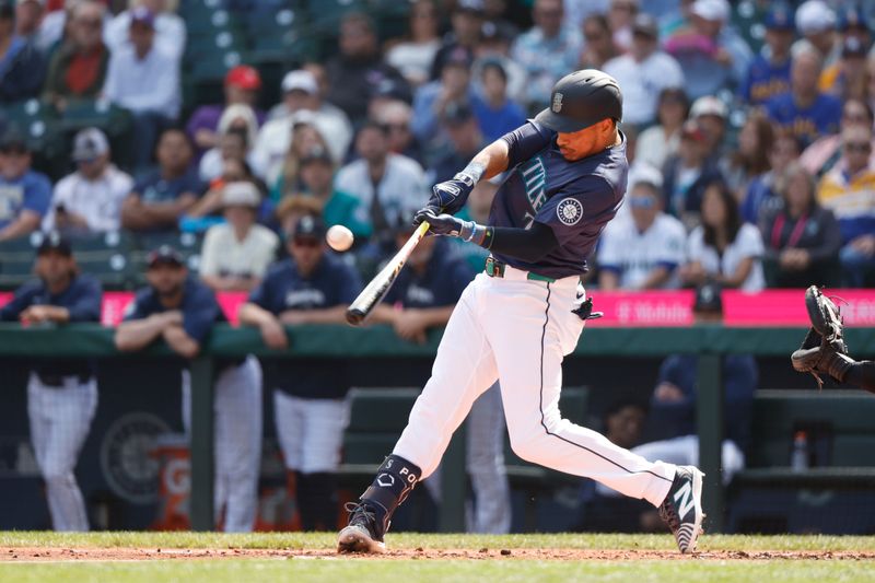 Sep 19, 2024; Seattle, Washington, USA; Seattle Mariners designated hitter Jorge Polanco (7) hits an RBI-sacrifice fly against the New York Yankees during the first inning at T-Mobile Park. Mandatory Credit: Joe Nicholson-Imagn Images