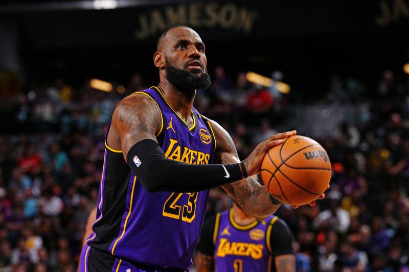 PHOENIX, AZ - OCTOBER 28: LeBron James #23 of the Los Angeles Lakers shoots a free throw during the game against the Phoenix Sunson October 28, 2024 at Footprint Center in Phoenix, Arizona. NOTE TO USER: User expressly acknowledges and agrees that, by downloading and or using this photograph, user is consenting to the terms and conditions of the Getty Images License Agreement. Mandatory Copyright Notice: Copyright 2024 NBAE (Photo by Kate Frese/NBAE via Getty Images)