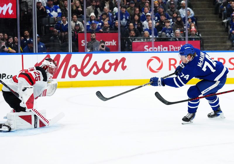 Dec 30, 2025; Toronto, Ontario, CAN; Toronto Maple Leafs center Bobby McMann (74) shoots on New Jersey Devils goaltender Jacob Markstrom (25) during the first period at Scotiabank Arena. Mandatory Credit: Nick Turchiaro-Imagn Images
