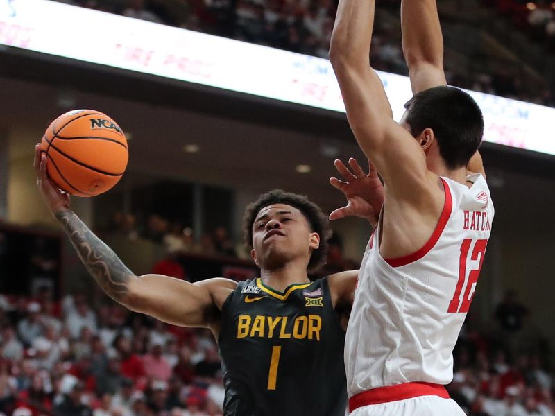 Jan 17, 2023; Lubbock, Texas, USA;  Baylor Bears guard Keynote George (1) goes to the basket against Texas Tech Red Raiders forward Daniel Batcho (12) in the first half at United Supermarkets Arena. Mandatory Credit: Michael C. Johnson-USA TODAY Sports