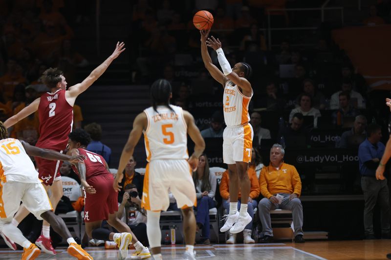 Jan 20, 2024; Knoxville, Tennessee, USA; Tennessee Volunteers guard Jordan Gainey (2) shoots a three-point shot against Alabama Crimson Tide forward Grant Nelson (2) during the first half at Thompson-Boling Arena at Food City Center. Mandatory Credit: Randy Sartin-USA TODAY Sports