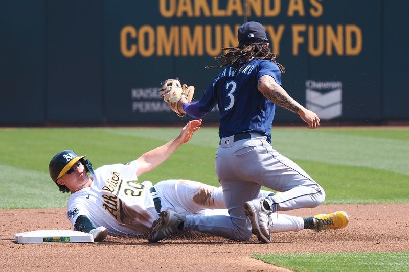 Sep 20, 2023; Oakland, California, USA; Oakland Athletics second baseman Zack Gelof (20) steals second base against Seattle Mariners shortstop J.P. Crawford (3) during the first inning at Oakland-Alameda County Coliseum. Mandatory Credit: Kelley L Cox-USA TODAY Sports